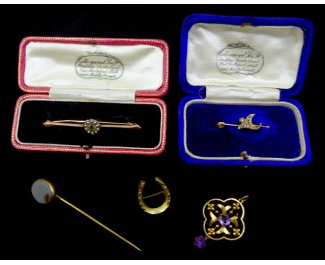 Victorian peridot and seed pearl bar brooch stamped 15ct, a 9ct gold seed pearl brooch both in original boxes, an amethyst go