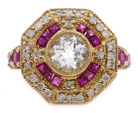 Gold ruby and diamond surround octagon dress ring, set with a central pale blue stone, stamped 10K Condition Report 4.5gm, si