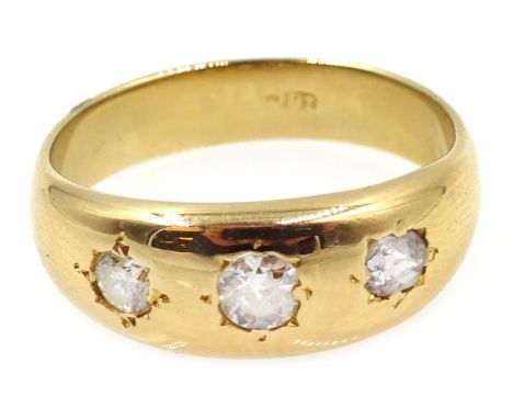 Gold three stone diamond gypsy ring, stamped 18c Condition Report Approx 4.3gm, size K