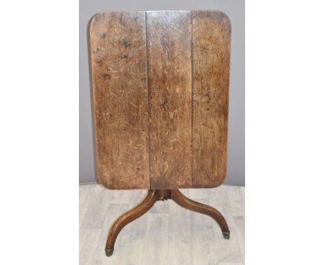 19thC oak tilt top table raised on a tripod base and stepped feet, W88 x D65 x H69cm