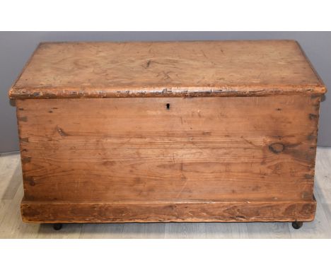 19thC pine trunk with twin drop handles on castors, W86 x D48 x H46cm