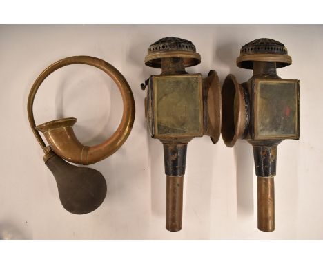 Two carriage lamps, one marked Limehouse Lamp Co, height 41cm, and a brass bulb horn
