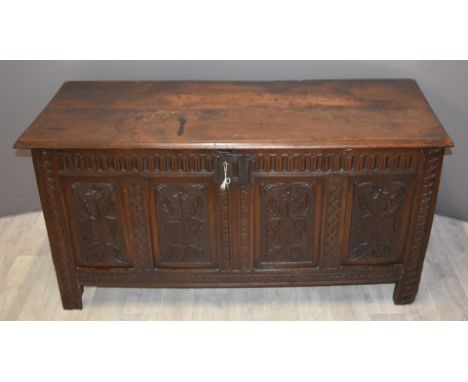 18th/19thC carved oak trunk with flower decoration, W154 x D54 x H68cm