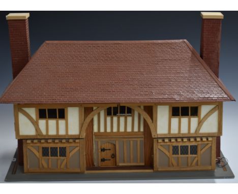 A 1:16 scale doll's house with lift off roof and first floor, electric lights, fireplace etc, W66 x D30 x H41cm