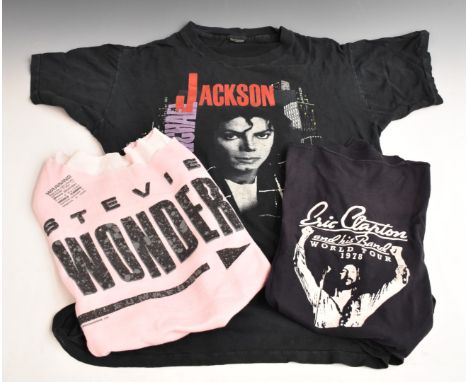 Michael Jackson 1988 Bad Tour T-shirt, together with Stevie Wonder Europe Tour 1984 sleeveless example and Eric Clapton World
