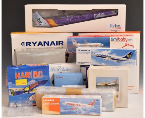 Eighteen 1:100 1:200 and 1:400 scale diecast and plastic model aircraft, all budget carrier liveries including Easyjet Boeing