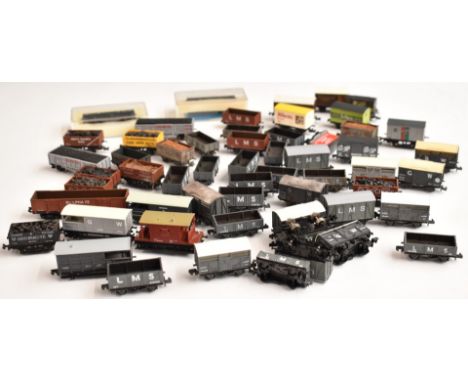Fifty-six Graham Farish, Lima or similar N gauge model railway goods wagons, brake vans etc including LMS, GWR etc.&nbsp;