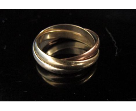 A 9ct gold three tone puzzle ring. Size Q, 4.3g 