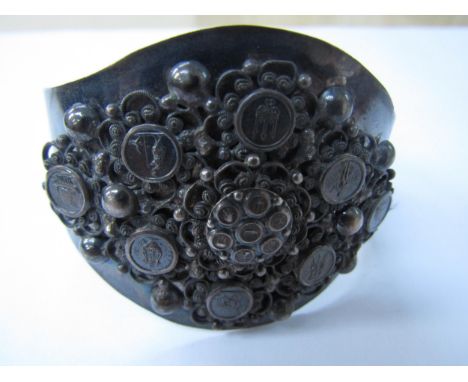 A white metal buckle bracelet with roundels depicting long boat, trident, figures etc, unmarked 