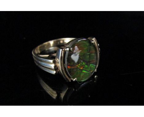 A gold ring with oval black opal doublet, stamped 10k. Size K, 3.3g 