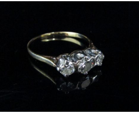 A three stone diamond ring, 0.80ct total approx. Size S, unmarked, 2.9g 