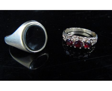 A 9ct gold onyx signet ring. Size L, shank bent, a 9ct gold garnet ring. Size O, 6.6g 