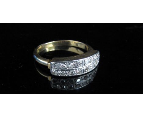 A gold ring set with two rows of diamonds, stamped 18ct. Size O, 3.8g 