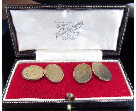 A pair of 9ct gold cufflinks, engine turned detail, 6.4g in fitted box 