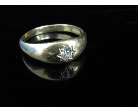 An 18ct gold ring set with a diamond in rubover star setting, 0.20ct approx. Size V/W, 5.1g 