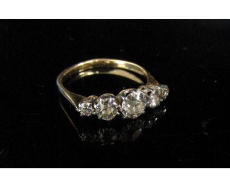 A gold five stone graduated diamond ring 1ct total approx. (solder repair to claw). Size N, 2.5g 