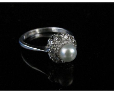 A pearl and diamond ring, the central pearl framed by old cut diamonds, stamped Plat. Size M, 3.7g 