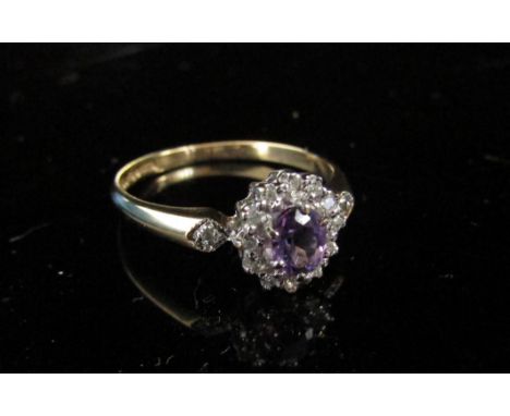 A 9ct gold amethyst and diamond ring. Size N, 1.9g 