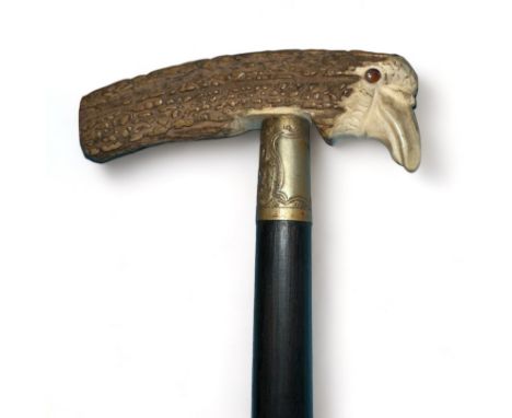 Ebonised sword Stick with antler handle depicting a birds head. Two very ornate top ferrules with blank cartouches. One ferru