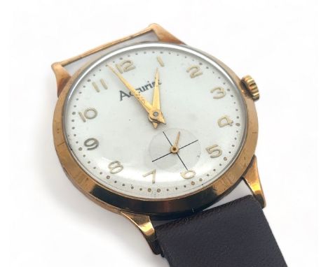 A 1950s Accurist 9ct gold gents manual wristwatch. Off-white dial with gold Arabic numerals and sub seconds dial. Case diamet