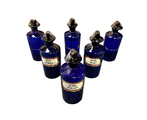 6 Cobalt Blue Apothecary Jars 24cm x 9cm, all 6 jars have chisel stoppers, one stopper has a chip on the rim. One jar has lab