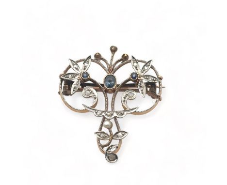 An Art Nouveau brooch set with sapphires, semi faceted diamonds and seed pearl brooch. One diamond and three seed pearls miss
