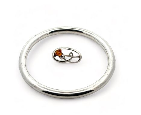A Charles Horner plain silver bangle, Chester 1921, and a silver Charles Horner brooch set with a paste (imitating citrine), 