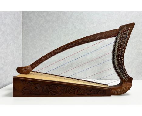 22 String Celtic Harp with Semitone Levers, comes with spare strings, a tuning wrench and a cushioned fitted case. In excelle