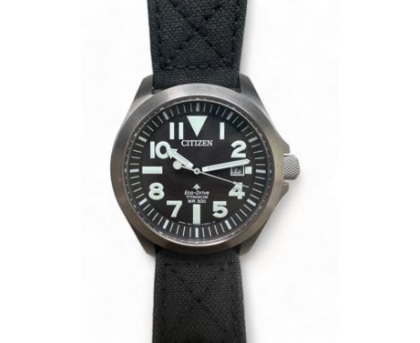 A Citizen Eco Drive wr300 E168-S115060 wristwatch. Titanium case with black dial, luminous hands, Arabic numerals and date di