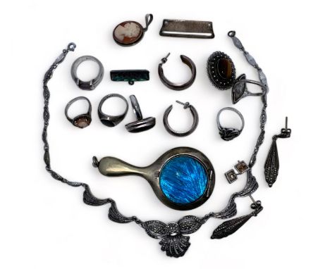 A range of silver jewellery items including a silver and marcasite necklace and earring set, two silver and marcasite rings, 