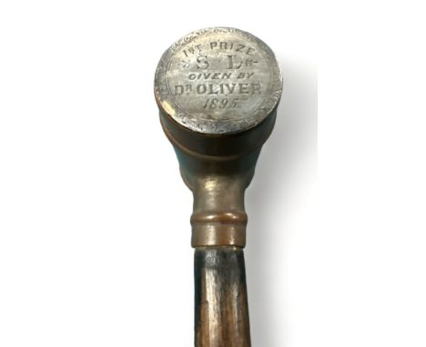 Ebonised walking Stick with unusual brass barrel handle. Inscription on one end of barrel: "1st prize S L Given By Dr Oliver 