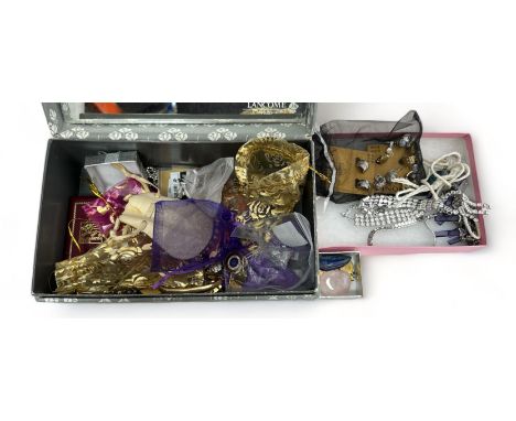 A box of costume and silver jewellery. Includes a rolled gold bangle, a silver necklace with amethyst pendant, silver chain, 