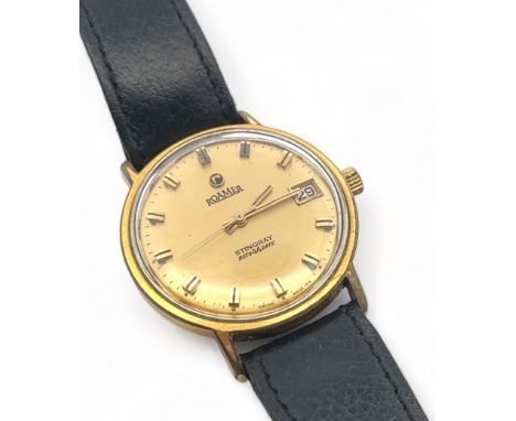 A 1960s Roamer Stingray Roto 44 Date manual gents wristwatch. Gold plated case with gold toned dial, baton hour markers and d