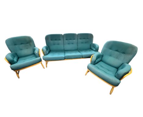 A three piece Ercol lounge suite to include a sofa and two armchairs (3) 