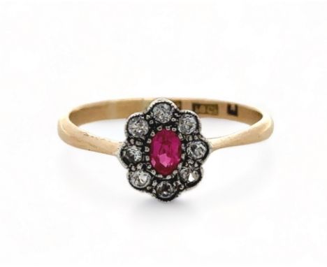 A ruby and diamond cluster ring, set in 18ct yellow gold. Size O. 2.03g.