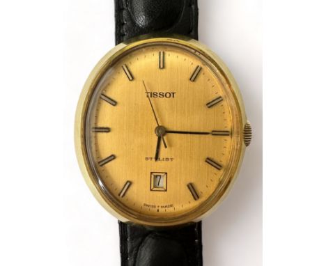 A Tissot stylist gold plated mechanical wristwatch. Oval champage dial with baton hour markers and date display at o'clock. B