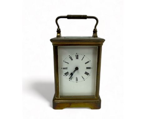 Victorian brass carriage clock, four bevelled glass panels, unnamed face with Roman numerals. Back plate marked with F F init