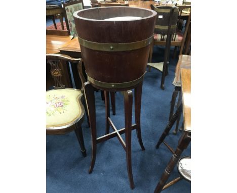 OAK PLANTER, the brass bound body on tripod legs