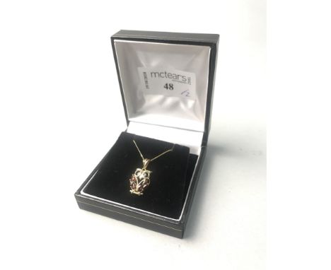 DIAMOND AND GARNET SET OWL PENDANT, on gold chain; along with a jade bracelet (2)