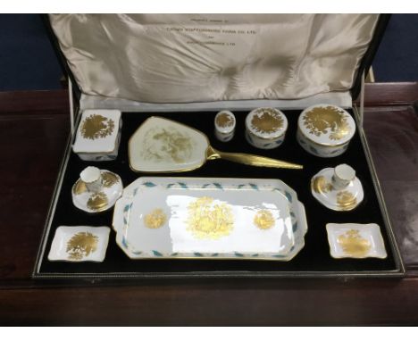 STAFFORDSHIRE DRESSING TABLE SET, comprising a hand mirror, a pair of candlesticks, three trinket boxes and a tray, the hand 