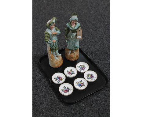 A tray of pair of continental bisque figures and set of six Royal Worcester hand painted china coasters 