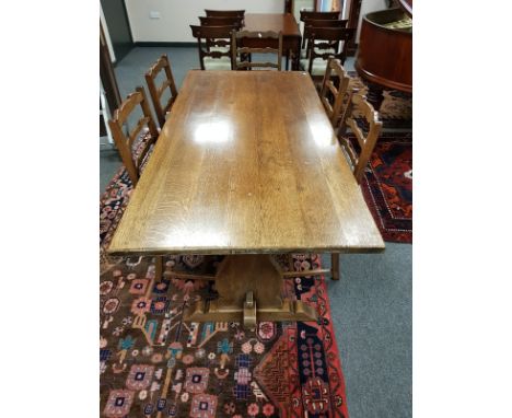 An oak refectory dining table, length 168 cm and five ladder back chairs 