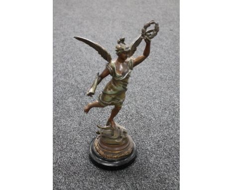 An early 20th century painted spelter figure of Hermes on wooden base 
