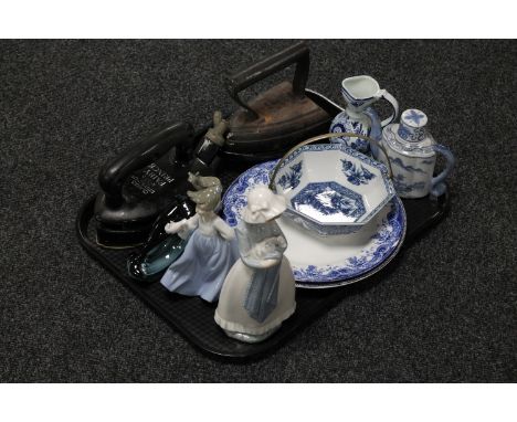 A tray of two Nao figures, Poole dolphin, Delft jug, Chinese style teapot, blue and white dish, two wall plates and two flat 