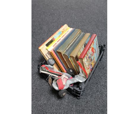 A crate of a pair of vintage roller skates, annual including Bunty for Girls, The Modern Book for Boys etc