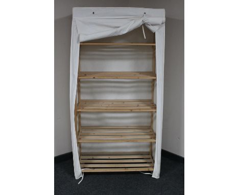 A pine canvas covered storage shelf 