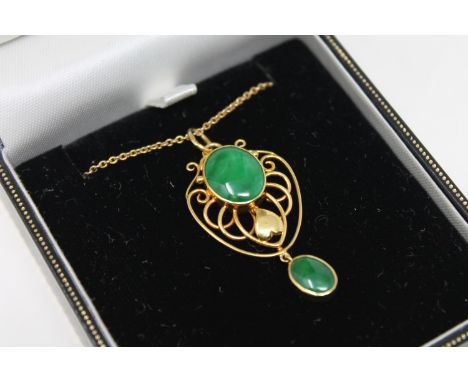A 15ct gold jade set pendant on chain