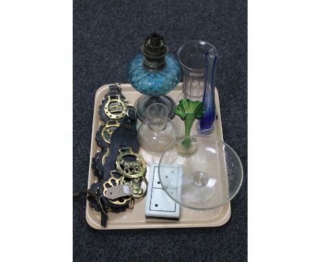 A tray of antique oil lamp with blue glass reservoir, glass vases, boxed domino's, horse brasses etc 