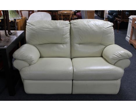 A two seater cream leather manual reclining settee 