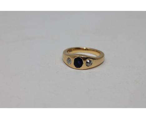 An 18ct gold diamond and sapphire three stone ring, size N CONDITION REPORT: 10.7g